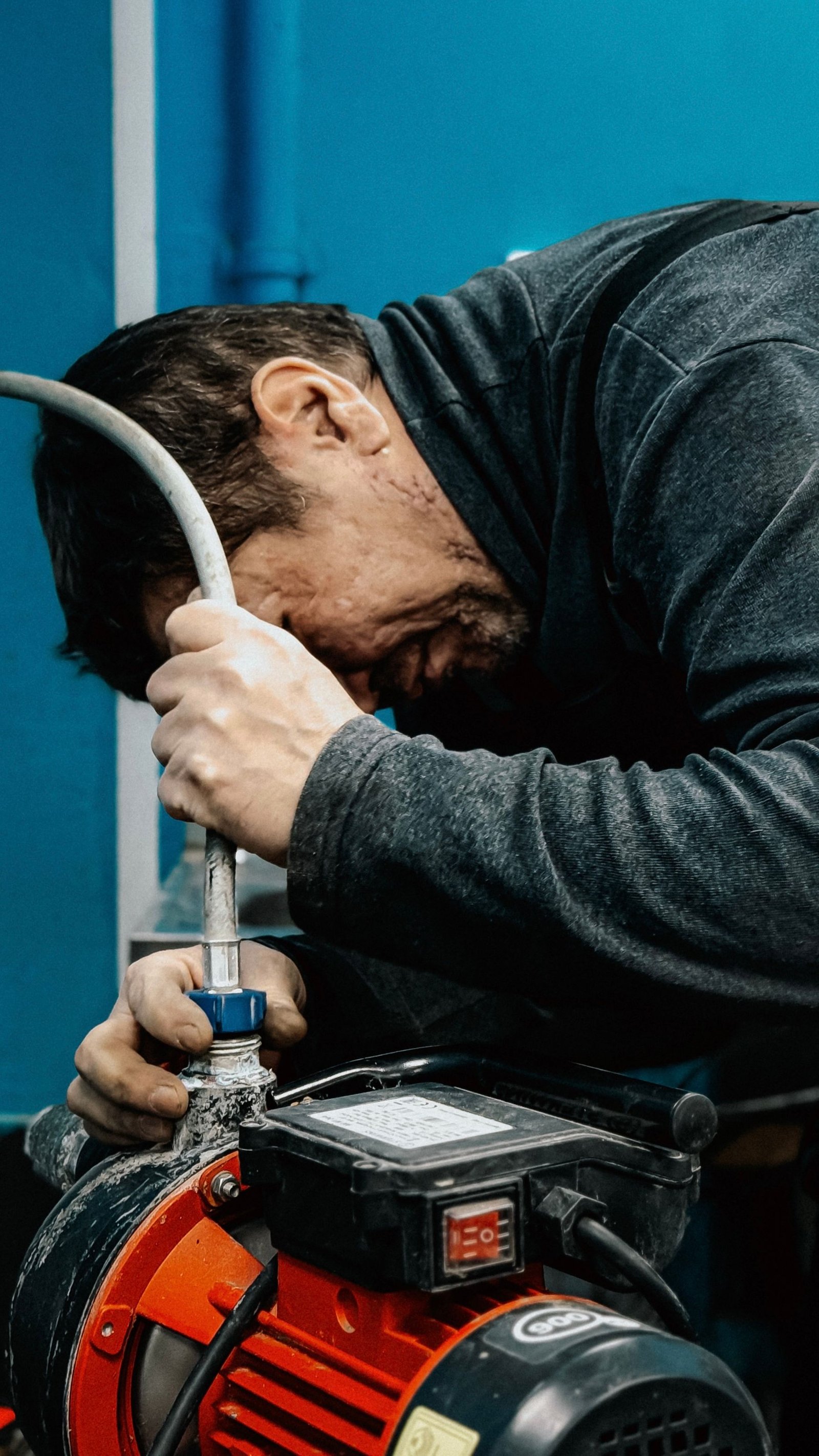 Technician servicing a compact water-system pump